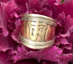 New adjustable Ring made from Copper and has Tibetan Om in the middle. Rope design on the rim. Size: 3/4" Spiritual Ceremonial Rings With Polished Finish, Spiritual Open Ring With Polished Finish, Ceremonial Spiritual Style Open Ring Jewelry, Spiritual Open Ring Jewelry For Ceremonial Occasion, Handmade Jewelry Ring For Meditation, Rope Design, Blue Hues, Adjustable Ring, Adjustable Rings