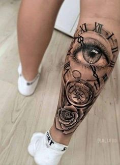 a woman's leg with an eye and clock on it