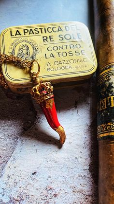 "Cornicello brings good luck unique in its kind because it is made entirely by hand giving its imperfect shape, as required by Neapolitan popular tradition. His design is in Bourbon style with a golden metal crown decorated with patina and gold leaf. The horn is made of ceramic and resin, it is hand painted with carmine red pigment and embellished with golden foil on the tip and in some parts of the horn based on inspiration. Its length is approximately 5/5.5cm/1.96\"/2.16 inches, but since each horn is handmade, the measurement is sometimes inaccurate, so please take this into consideration before ordering. The chain is golden steel, fine and simple with a length of 30cm/11.81 inches. It turns out to be a beautiful gift to give because it is designed by the artist based on the inspiration Artisan Red Necklace For Gift, Handmade Red Jewelry For Souvenir, Red Amulet Jewelry For Gifts, Red Amulet Jewelry For Gifting, Red Amulet Jewelry As Gift, Artisan Red Collectible Necklaces, Antique Red Handmade Necklace, Antique Red Handmade Necklaces, Antique Red Jewelry For Gifts