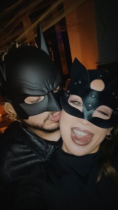 a man and woman dressed up as batman