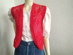 70 crochet vest, vivid red handknitted vest, floral mesh vest, buttonless vest, bright red, retro vest, summer knitted vest, boho bohemian spring vest. very good vintage condition, but the item is not dry clean or washed  please check the measurements before ordering Measurements laying flat : shoulders :36 cm (14 inches) bust: 36 cm (14 inches) total lenght:54 cm (21 inches) Fitted Red Sweater Vest For Spring, Red Sleeveless Sweater Vest For Summer, Red Sleeveless Crochet Top, Vintage Red Vest For Summer, Red Vintage Vest For Summer, Red Vintage Summer Vest, Red Crochet Top For Spring, Red Bohemian Vest For Summer, Bohemian Red Summer Vest