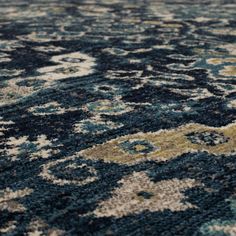 an area rug with blue, yellow and white colors