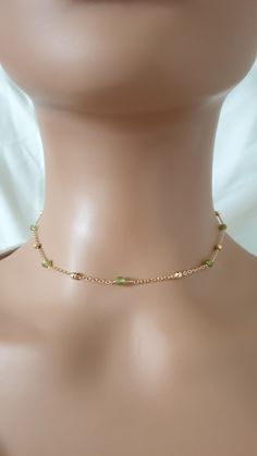 The necklace is made with gold plated chain, natural peridot beads (3 mm) and gold plated brass lobster clasp.  The length of the extension is approximately 2 inches.  Please contact me in case you have any questions. Please note: store your jewellery individually to keep them from scratching each other. Avoid contact with perfume, body lotions, hairspray or any other chemical. Gold Beaded Necklaces For May Birthstone, Green 14k Gold Filled Jewelry With Delicate Chain, Delicate Green 14k Gold-filled Jewelry, Dainty Green Beaded Chain Jewelry, Green Dainty Jewelry With Tiny Beads, Green Minimalist Beaded Chain Jewelry, Minimalist Green Beaded Chain Jewelry, Dainty Green Jewelry With Tiny Beads, Dainty Gold Beaded Choker