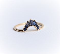 "Our Ophelia XL baguette crown set in lab-created blue sapphire. This band fits a 1 ct+ Pear, Oval, and Marquise engagement ring.  Before you order the band, please order a home try-on wax model here https://etsy.me/2TRvaLz There will be a 20% restocking fee deducted from your refund in case you need to return the band. So we highly recommend ordering the wax sample to see how it fits with your engagement ring.  ❁❁ I T E M ∙ D E T A I L S ❁❁ ✦Stone: Lab-Grown Blue Sapphire Approximately Total Ca Sapphire Engagement Ring With Band, Sapphire Engagement Ring With Wedding Band, Sapphire Wedding Ring Set, Blue Wedding Band, Marquise Engagement Ring, Baguette Band, Contour Band, Sapphire Wedding Ring, Unique Wedding Band