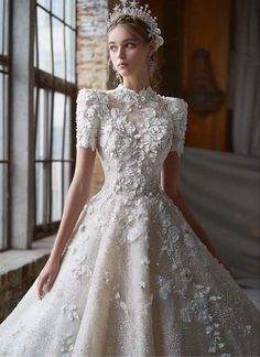 a woman in a wedding dress with flowers on it