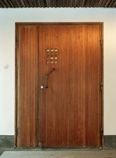 an open wooden door with numbers on it