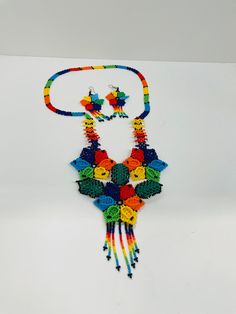 a multicolored beaded necklace and earring set