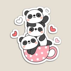 two pandas sitting on top of each other in a cup with hearts around them