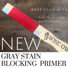 a close up of a toothbrush with the words new gray stain blocking primer on it