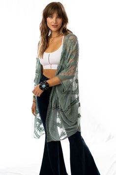 A bit of whimsy and lace makes this kimono the perfect layering piece! It features a shear fabric with lace and intricate embroidered details throughout. Model is 5'8" and wearing a one size. 100% PolyesterSize : 45" x 48"Armhole : 9" Velvet Fringe Kimono, Ruffled Denim Jacket, Boho Summer Style, 40 Aesthetic, Summer Editorial, Velvet Fringe, Fringe Kimono, Lace Sleeve Top, Boho Fashion Summer