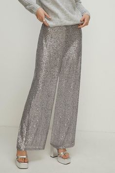 A wardrobe hero, updated for the festive season. Designed in a classic wide leg style with a flattering high-rise finish, these trousers come complete with high-shine sequins for an invite-ready feel. Pair with silk blouses and strappy heels for an elevated evening look. Christmas Party Shoes, Tanned Makeup, Silk Blouses, Velvet Clothes, Sequin Outfit, Christmas Party Outfits, Oasis Fashion, Evening Shoes, Strappy Heels