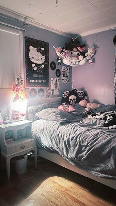 a bedroom with hello kitty decorations on the wall