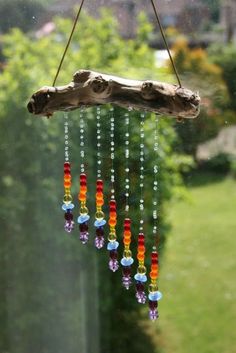 a wind chime hanging from a tree branch