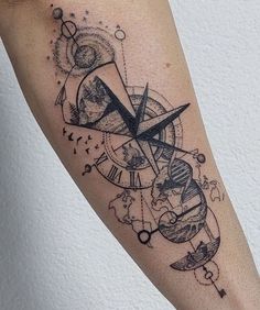 a black and white photo of a clock with planets on it's side arm