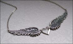 Angel Wing Jewelry~Necklace Earrings SET, Angel Wing Necklace AND Angel Wing Earrings, Silver Wing Jewelry, Vintage Style Detailed Pendants TWO PIECE JEWELRY SET: SET INCLUDES: Angel Wing Necklace adorned with small heart charm AND matching Angel Wing pendant earrings. Sterling Silver Plated Pendants and Charm. Long Kidney Style Ear Wires are used. (Need a different ear backing, convo me.) Gift boxed for you, perfect gift for her! Professionally plated in a rich thick sterling silver with an oxi Angel Wings Jewelry, Remembrance Jewelry, Jewelry Gift Guide, Wing Jewelry, Angel Wing Necklace, Angel Wing Pendant, Angel Wing Earrings, Silver Bracelets For Women, Chic Necklace