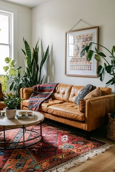 a living room filled with furniture and plants