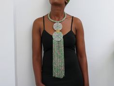 African Pendant necklace, Beaded Fringe Necklace, Beaded Multi-strand necklace, Statement Necklace, Christmas gift for her, Moms gift An elegant necklace that can match any outfit. Handmade by the Maasai women in Kenya using fine beads. Color: pink and green Available in different colors. Kindly select your color Dimensions:  Necklace length: 22 inches/ 55 cm Neck size: 15 inches / 38 cm 3-5 days delivery via DHL Express.  Pay shipping fee for the first item only and additional items ship for free. To view more items in our shop, kindly click here:  nkoroicrafts.etsy.com Unique Beaded Necklaces With Round Beads For Celebration, Party Large Beads Round Beaded Necklaces, Bohemian Beaded Necklaces With Faceted Beads For Celebration, Bohemian Beaded Necklaces For Celebration With Faceted Beads, Colorful Round Beaded Necklaces For Celebration, Beaded Necklaces With Round Beads For Celebration, Long Beaded Necklaces For Celebration With Polished Beads, Green Large Beads Necklace For Party, Long Polished Beaded Necklaces For Celebration