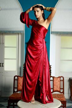 Deep maroon one-shoulder padded gown featuring drape detailing with asymmetric neckline. - Aza Fashions Maroon Gown, Deep Maroon, Gown For Women, One Shoulder Gown, Asymmetric Neckline, Asymmetrical Design, Full Sleeves, Indian Wear, Aza Fashion