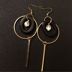 Gold Circle Dangling Earrings With Black Oval, Dangling Bar And Gem In The Center. The Black Piece Can Be Moved Behind The Gold Circle Or In Front Depending On How You Want It To Look. Material Is Stainless Steel Painted Gold I Believe. Never Used, No Signs Of Tarnish Or Wear. Accepting Offers Chic Black Round Earrings, Black Dangle Hoop Earrings For Party, Chic Black Hoop Earrings For Party, Chic Black Hoop Jewelry, Black Hoop Earrings For Evening, Stainless Steel Paint, Black Circle, Gold Circle, Dangling Earrings