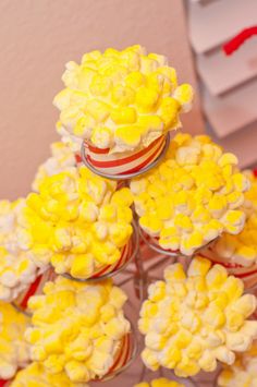 there are many cupcakes with yellow flowers on them