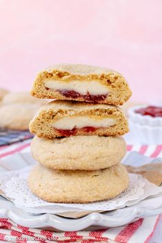 three strawberry shortcakes stacked on top of each other in front of a pink background