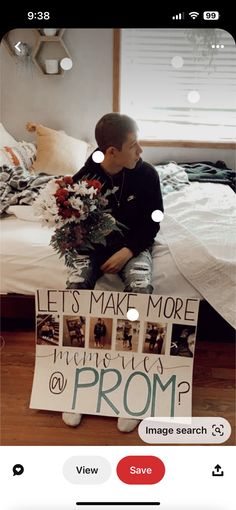 a boy sitting on top of a bed next to a bouquet of flowers and a sign that says, let's make more friends prom