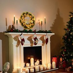 a mantel with candles and stockings on it