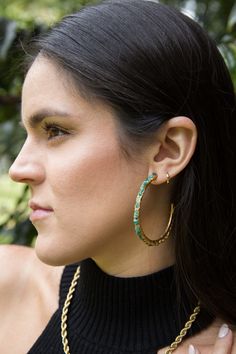 By Fenomena Unique dainty hoop earrings handmade with REAL Raw and Natural Colombian Emeralds that represent the unique beauty of our country Colombia. Fenomena's jewelry is a mix of the modern and the classic (seeking for timeless pieces), where the emerald is the protagonist and plays a central role in the design. Material: Raw Emeralds & 24K Gold over Brass Handmade in Colombia This unique piece is made with Colombian emeralds in the rough Since this product is handmade, gem sizes may vary Av Artisan Hoop Pierced Earrings, Artisan Hoop Pierced Jewelry, Adjustable Hoop Earrings For Jewelry Making, Nickel-free Hoop Earrings Fine Jewelry, Artisan Hoop Earrings, Artisan Hoop Jewelry As A Gift, Artisan Hoop Earrings For Pierced Ears, Green Tarnish-resistant Hoop Jewelry, Fine Jewelry Adjustable Hoop Earrings