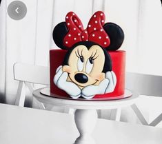 a minnie mouse cake sitting on top of a table