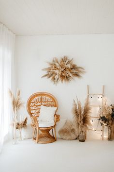 a room with white walls and lots of decorations on the wall, including a wicker chair