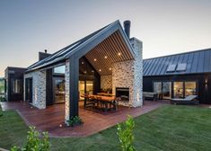 a house with a covered patio and outdoor dining area