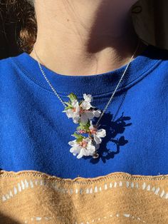 Created by requests, these dainty handmade silver coil necklaces are great for carrying any little sprig of flowers with you!  ~ Simply slide a little (real or fake) flower into the base holder to display! ~ Handmade in Amesbury, MA by Holly with love and sterling silver plated wire!🌿 ~ Purple flower is in a medium cage & yellow is in a small. (no flower included). Sizes: Small: pendant is .75" Medium: pendant is 1.5" Large: pendant is 2" This listing is for one (1) Flower Holder Necklace. PEND Bohemian Sterling Silver Flower Necklace, Delicate Spring Jewelry Gift, Delicate Spring Jewelry For Gift, Silver Jewelry With Handmade Flowers For Gift, Silver Jewelry With Handmade Flowers As A Gift, Whimsical Flower Necklace For Gifts, Silver Bohemian Necklace For Spring, Delicate Flower Necklaces For Spring, Spring Flower Pendant Jewelry Gift