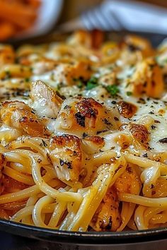 a close up of a plate of food with pasta