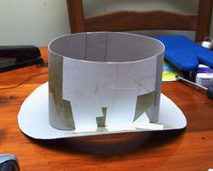 a paper hat sitting on top of a wooden table