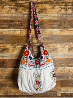 This beautiful Mexican Satchel or Morral is perfect to style with any outfit!  It is hand embroidered and has a hand knit strap that can be removed and used as a belt as well! Patterns and secondary colors may vary. Mexican Bag, Secondary Colors, Wayuu Bag, Embroidered Bag, Polyester Yarn, Hand Embroidered, Hand Knitting, Tassels, Satchel