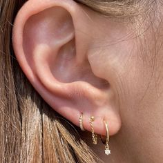 A twist on your classic gold hoops - the starry night diamond drops feature a sparkling prong set diamond charm. -14k gold -2 round sparkling prong set diamonds tcw 0.07 -10mm diameter Questions? shop@katiediamondjewelry.com Gold Hoop Ear Stack, Simple Gold Earring Stacks, Delicate Earrings Gold, Simple Curated Ear, Three Piercing Stack, 3 Stack Earrings, Cubic Zirconia Dangle Jewelry With Star Charm, Cubic Zirconia Star Charm Dangle Jewelry, Gold Earring Stack 3 Holes