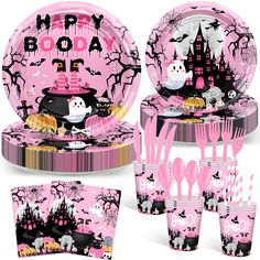 a pink halloween themed tableware set with black and white designs