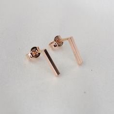 "14K Rose Gold Bar Earrings. 14K Rose Gold Simple Earrings. 14K Solid Rose Gold Minimalist Earrings 14K solid rose gold bar. It is 1.5mm wide. (Please select the length of bars : 3/8\", 1/2\" 5/8\")  The model in the picture wears 3/8\" bar earrings. 14K solid rose gold ear wire" Elegant Rose Gold Linear Earrings For Everyday, Dainty Rose Gold Linear Earrings For Formal Occasions, Dainty Rose Gold Linear Earrings For Everyday, Modern Rose Gold Linear Earrings For Formal Occasions, Elegant Everyday Rose Gold Linear Earrings, Minimalist Rose Gold Linear Earrings For Gift, Dainty Everyday Linear Rose Gold Earrings, Minimalist Rose Gold Linear Earrings Gift, Rose Gold 14k Linear Earrings For Pierced Ears