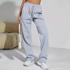 Upgrade your activewear with these gray high-waist sports pants, designed for both style and comfort. Featuring a slimming fit and lace-up detailing, these sweatpants offer a chic look while providing all-day comfort. The drooping straight leg design adds a modern touch, making them perfect for workouts or casual outings. Versatile and trendy, these sweatpants are a great addition to your wardrobe for both exercise and leisure. Gray Sports Pants, Winter Bottoms, Sweatpants For Women, Pleated Skirt Short, Sports Pants Women, Plaid Pullover, Vest Blazer, Faux Leather Dress, Vest Coat