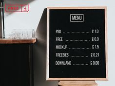 a menu board sitting on top of a wooden table