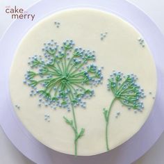 a cake decorated with green and white frosting