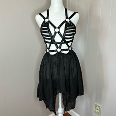 Be A Goddess Who Demands Attention With This Mini Dress That Has A Strappy Vegan Leather Harness Design, O-Ring Hardware, Adjustable Snap Button Closures, Adjustable Shoulder Straps, A Lightweight Semi-Sheer Skirt With Materials: 100% Cotton; Combo: 100% Polyurethane Care: Hand Wash Cold, Hang Dry Dark Celestial, Be A Goddess, Harness Design, Sheer Skirt, Leather Harness, A Goddess, Dolls Kill, O Ring, Snap Button