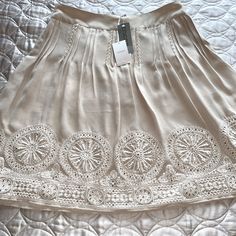 This Is A Beautiful “Pinenut” Color Embroidered Skirt. It Is Lined And Has A Side Zipper. The Top Of Skirt Is Pleated And The Bottom Of The Skirt Is Embroidered With Sequins Details All Around The Skirt.. Just Beautiful. No Rips Stains.No Snags..It Is A Size 2 So It’s A Large 12 Refer To Sizing Chart For Chico’s.. Any Questions Comment Below. Thanks For Looking Embroidered Cream Skirt For Summer, Summer Cream Embroidered Skirt, Embroidered Skirt, Sequin, Side Zipper, Boho Outfits, Womens Skirt, Women Shopping, Clothes