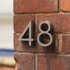 a brick wall with the number eighty eight on it