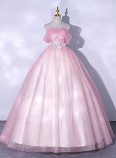 The v neckline has slim straps that wrap right into a shoelace up back closure. The full tulle skirt drops gently from the waistline as well as includes a sweep train. Organza Ball Gown For Debutante Ball And Prom Season, Princess Style Tulle Gown, Tulle Floor-length Gown For Debutante Ball, Floor-length Tulle Gown For Debutante Ball, Tulle Quinceanera Dress For Prom, Tulle Quinceanera Dress With Sweep Train, Tulle Floor-length Quinceanera Dress For Debutante Ball, Formal Tulle Quinceanera Ball Gown Dress, Floor-length Tulle Ball Gown For Quinceanera