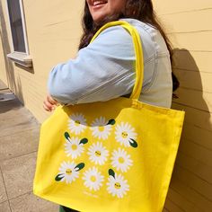 Brighten your day with this happy yellow tote bag featuring a screenprinted illustration by Vica Lew! This cotton tote is roomy and comes with a bottom gusset that makes it perfect for carrying all your essentials for your daily adventures. ♥   ★★  ITEM DESCRIPTION  ★★ - Illustration is screen printed on a 100% cotton tote bag - Approx. 20in x 15in x 5in - Bottom gusset - Approx. 10in handle drop ★★  CARE INSTRUCTIONS  ★★ - Spot clean with a damp cloth and allow to air dry - Using a washing mach Spring Yellow Canvas Bags, Spring Yellow Canvas Bag For Everyday Use, Spring Yellow Canvas Bag For Everyday, Spring Yellow Canvas Bag For Daily Use, Yellow Canvas Bag For Everyday Spring Use, Large Capacity Yellow Cotton Canvas Bag, Yellow Cotton Tote Bag, Yellow Cotton Canvas Shopping Bag, Yellow Eco-friendly Canvas Bag For Daily Use