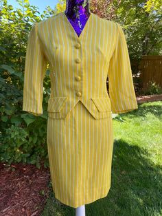 "1950s 1960s Yellow Pinstripe Skirt Suit Set Trude Junior California Sold locally here in Denver through the now defunct department store Gano-Downs. Material feels like a linen blend, lined in an off white acetate-like fabric. 3/4 sleeve. Faux/decorative pocket flaps. Skirt closure with a top button and plastic zip in back. Condition: Wonderful vintage condition. No concerns to note. Please note measurements below, taken with garment flat and doubled where appropriate. Fits like a modern size X Retro Fitted Skirt Suit For Spring, Retro Fitted Skirt Suit, Pinstripe Skirt, 1950s Skirt, Pink Cotton Dress, Skirt And Jacket, Skirt Suit Set, Pinstripe Suit, Jacket Vintage