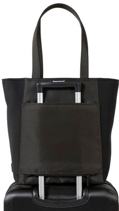 Our versatile tote is designed for the daily commute, overnight business trip or weekend getaway. Interior slip pockets on each end of the tote are designed for a quick and easy shoe change, whether from the office to the gym or the tarmac to the train platform. The luggage handle pass-through makes this an ideal add-on piece with the slide of a zipper, or a convenient pocket for essentials when zipped. This spacious yet sleek modern tote includes a padded 15" laptop sleeve. Modern Travel Bag With Handles For Everyday Use, Commuting Tote Shoulder Bag With Luggage Sleeve, Modern Travel Bag With Handles For On-the-go, Commuting Tote Travel Bag With Top Handle, Commuter Tote Travel Bag With Top Handle, Functional Travel Bag For Shopping, Large Capacity Tote Travel Bag For Commuting, Business Travel Tote Bag With Handles, Versatile Tote Travel Bag For Commuting