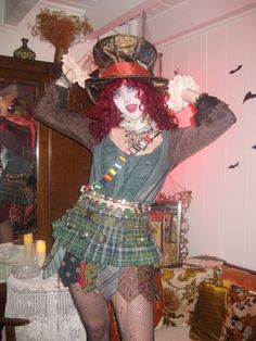 a woman with red hair wearing a costume