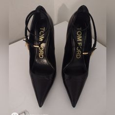 Gorgeous Tom Ford Black Leather Pointy Heels. Detachable Leather Cord With Gold Dangling Lock & Key. Wraps Twice Around Your Ankle. Classic Tom Ford Gold Stiletto Heel. Dust Bag Is Included. These Shoes Are In Really Good Gently Used Condition With Some Light Wear To The Outer Soles. Leather Looks Really Good All Around, Just Some Minimal Creasing As Expected. The Creasing Does Even Out When Shoe Is On The Foot. Please Look Closely At All Photos & Comment Any Questions Below! Size Eu 37 Made It Gold Stiletto Heels, Tom Ford Shoes, Ford Black, Pointy Heels, Locks & Key, Stiletto Heel, Leather Cord, Tom Ford, Shoes Women Heels